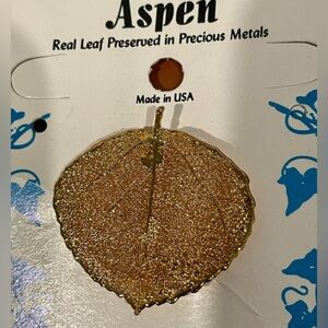 Real leaf preserved in precious metals - used as decorative lapel pin or pendant